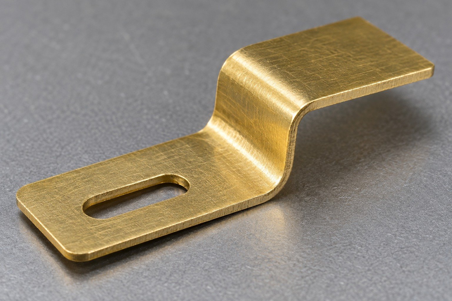 Bend transition and edge review on a thin formed brass tab — illustrative generated component concept