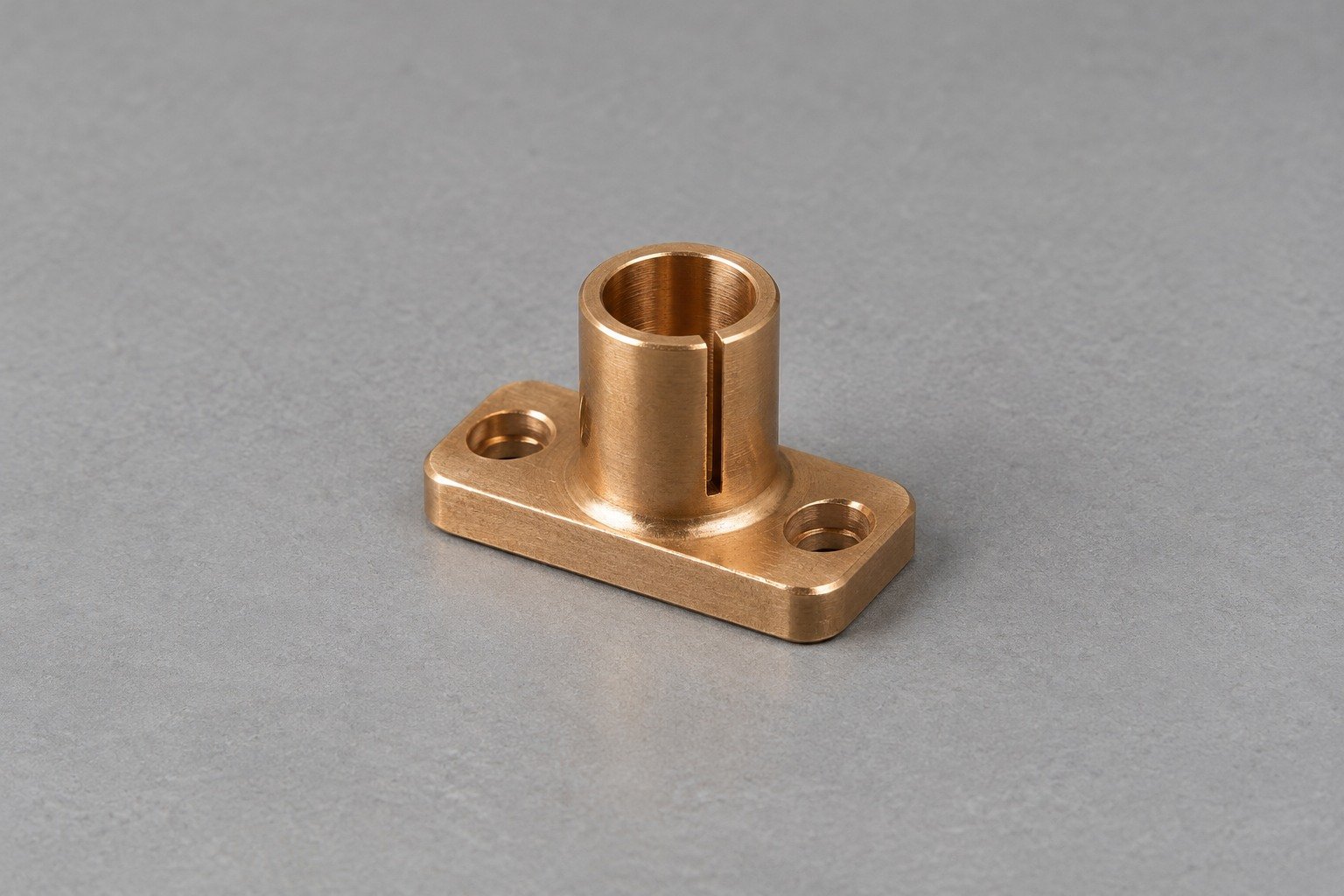 Illustrative compact bronze split-collar connector with two-hole mounting foot