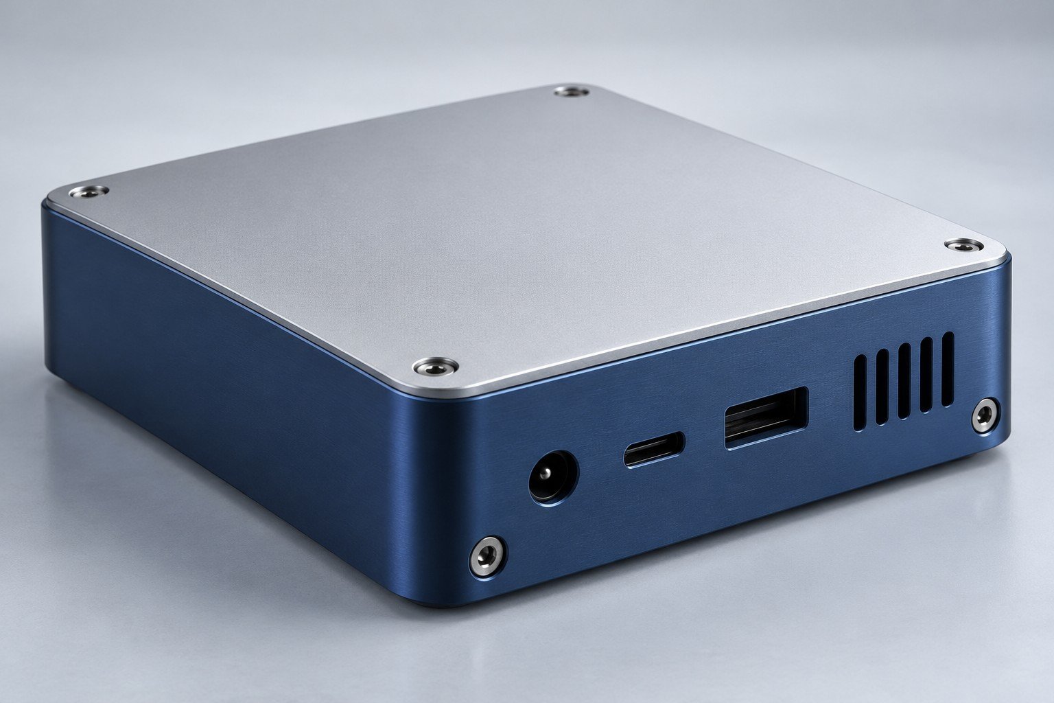Dark-blue aluminum electronics housing with a fitted silver lid and connector openings;illustrative component concept,not a customer part or documentary company test